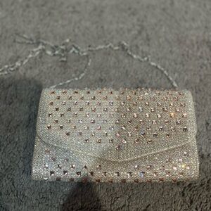 Silver Clutch with Intricate Rhinestone Design